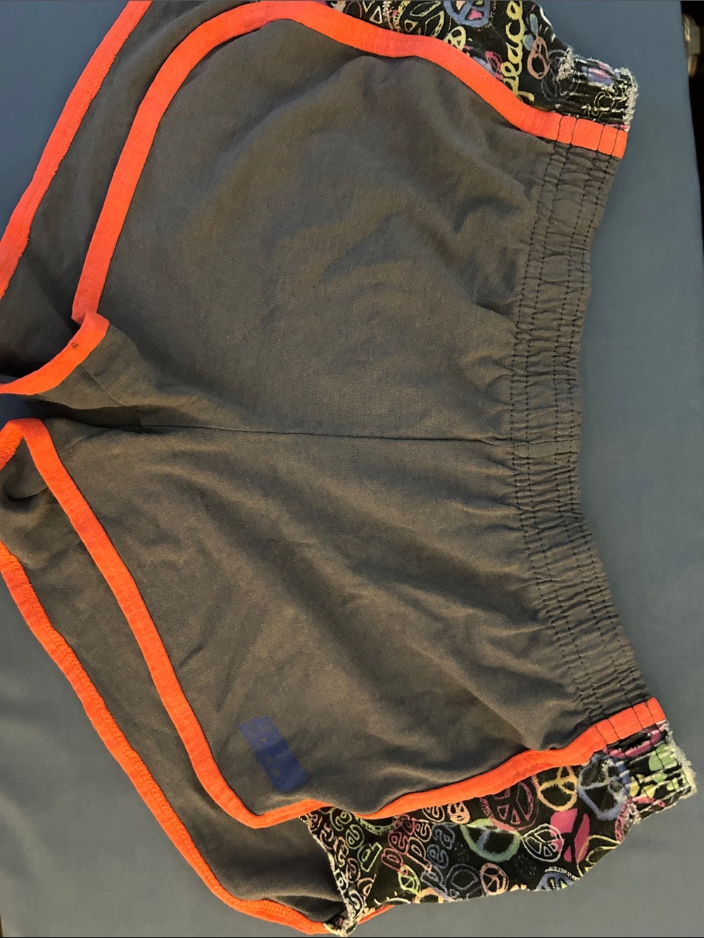 Soffe Black Shorts with Orange Trim and Multicolor Peace Sign Panels